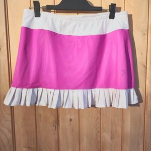 Pink and white pleated  tennis skirt with a pink overlay.